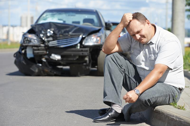 Man after car accident thinking of personal injury lawyer